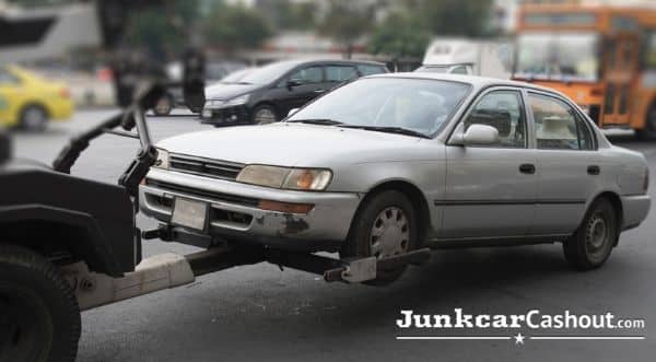 Car being towed - How to junk salvage car - Junk Car Cash Out