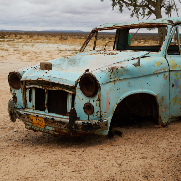 Neglected Junk Car in Utah Driveway